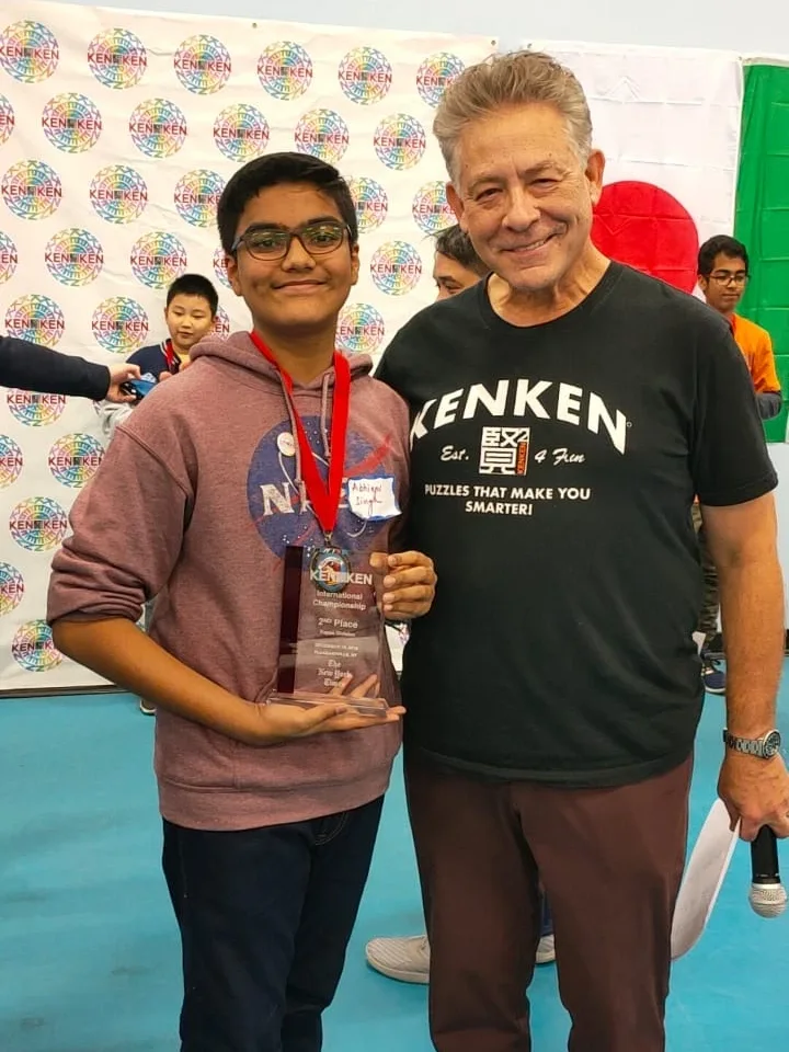 Robert Fuhrer with a young second-place finisher at the KenKen International Championship